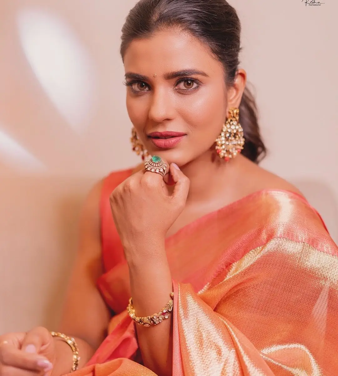 Indian Actress Aishwarya Rajesh in Orange Pattu Saree Blouse